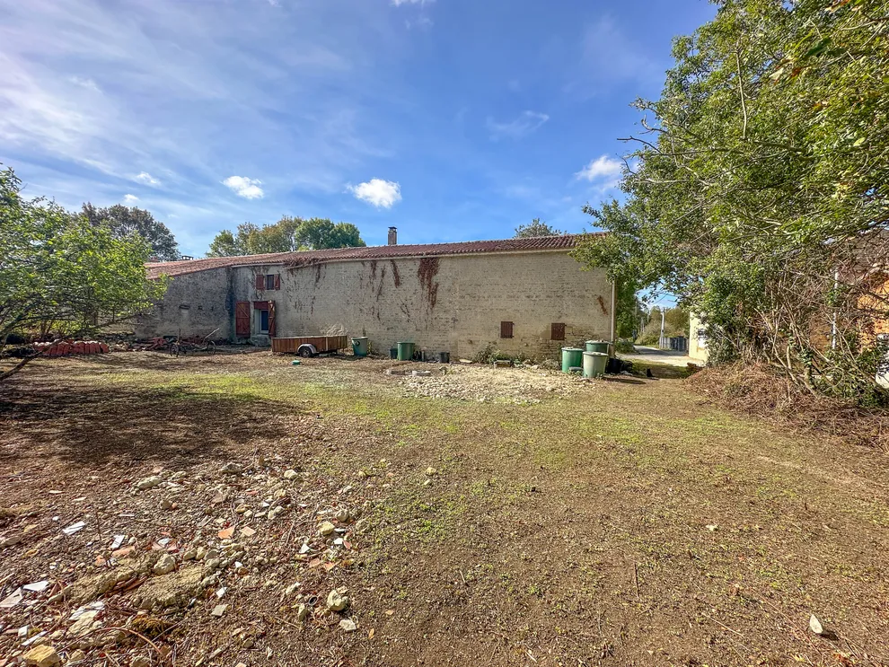 Semi-detached stone country house with garden in Saint-Georges-de-Longuepierre photo 2