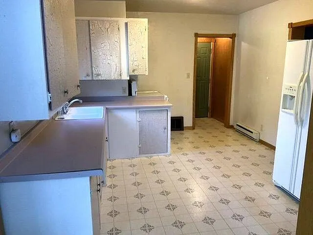 Charming 3-Bedroom Home with Attached Garage for Sale at 317 5th St SE, Rugby, ND photo 9