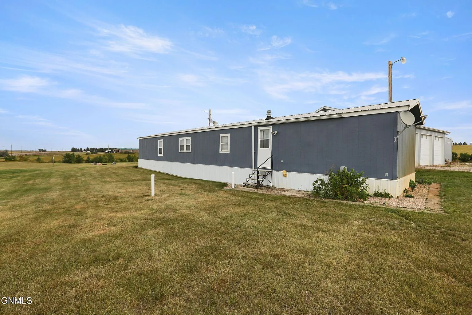 Private Country Oasis with Updated Manufactured Home and Exceptional Shop Space photo 6