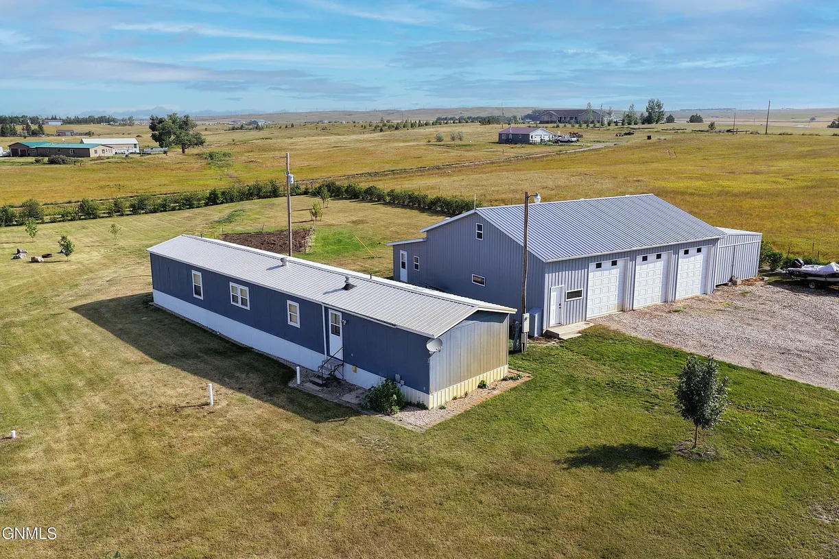 Private Country Oasis with Updated Manufactured Home and Exceptional Shop Space