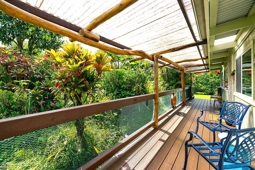 Tropical Island Retreat with Two Garages on a Landscaped Acre in Pahoa photo 3